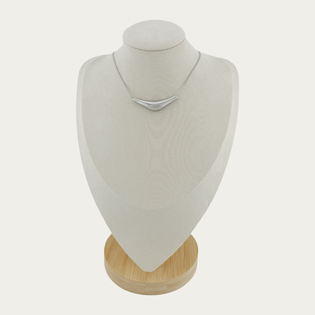 Solace Curve Necklace on a mannequin bust with a white background