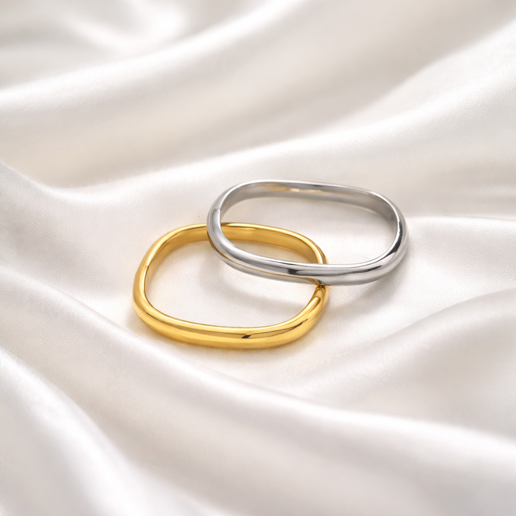 Calm Bangle features a softly rounded silhouette with a high-polish finish, in gold or silver