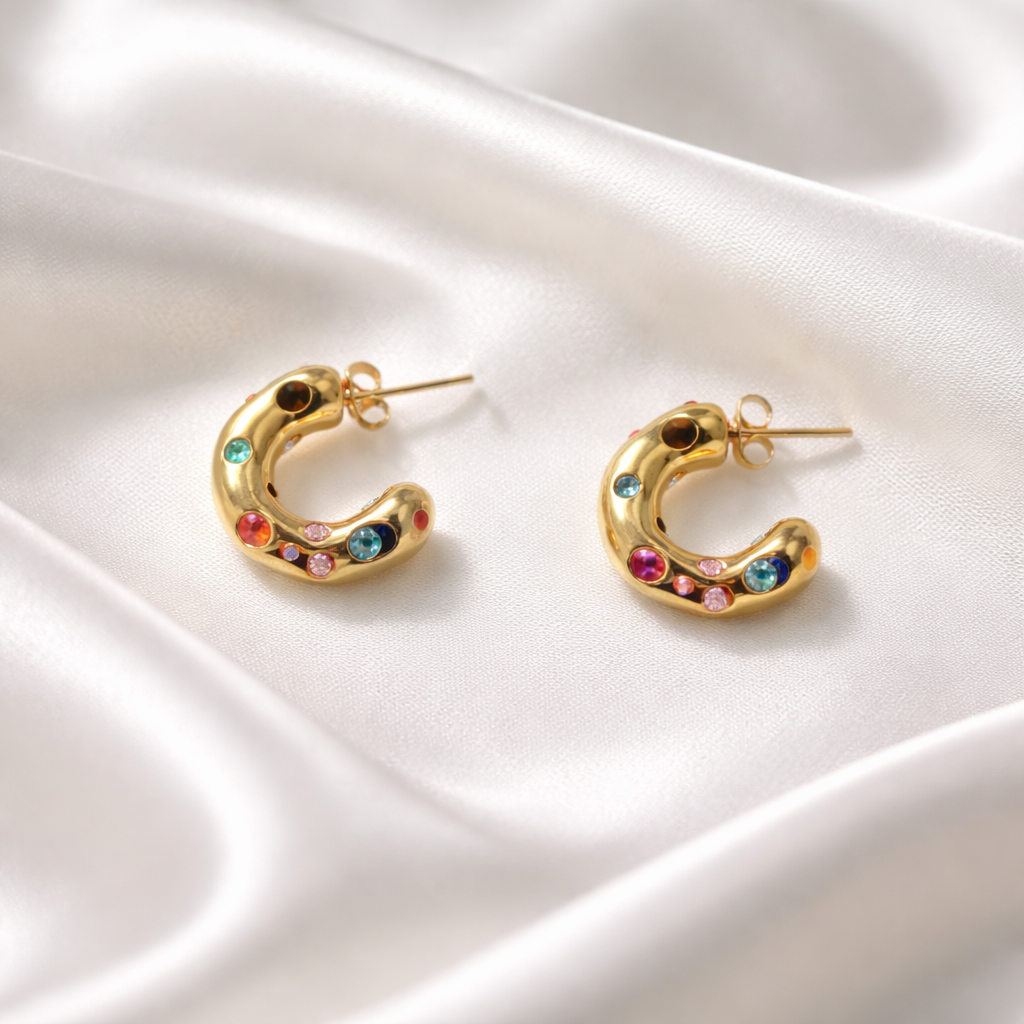 Lumière Gem Hoops feature a petite C-shaped silhouette accented with multicolored crystal details for a vibrant touch of sparkle