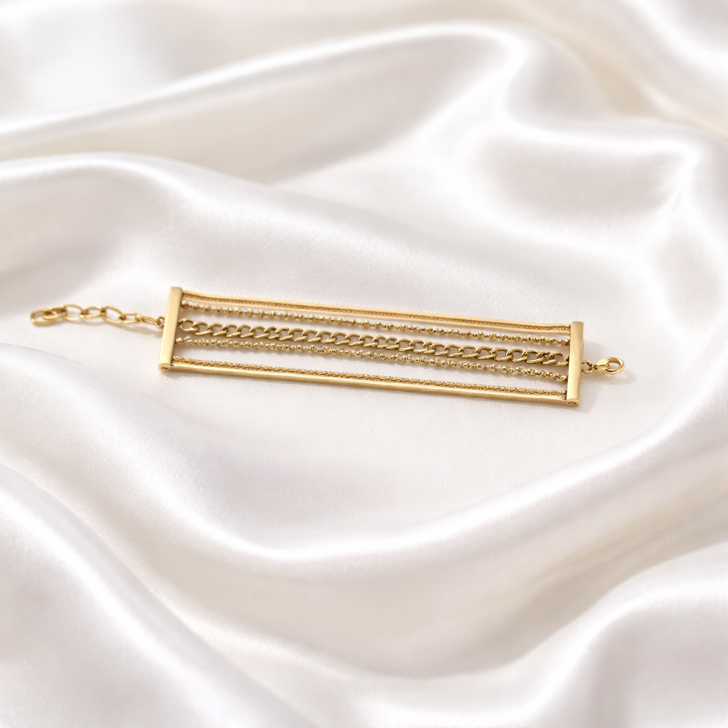 Verve Layered Bracelet features a multi-chain design framed within a sleek gold silhouette blending delicate and chunky links